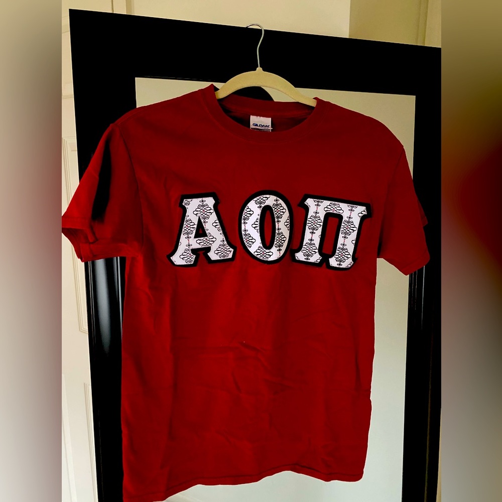 Alpha Omicron Pi stitched letters on red Gildan cotton shirt. Size Small.
